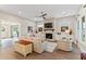 Relaxing living room with a fireplace, built-in shelving, and hardwood floors at 105 Summerlin Dr, Canton, GA 30115