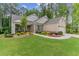 Brick and stone home with a large front yard and attached garage at 105 Summerlin Dr, Canton, GA 30115