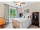 Bright bedroom with a queen bed and large window at 105 Summerlin Dr, Canton, GA 30115