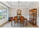 Formal dining room with hardwood floors, chandelier, and large windows at 105 Summerlin Dr, Canton, GA 30115