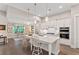 Spacious kitchen with white cabinets, large island, and stainless steel appliances at 105 Summerlin Dr, Canton, GA 30115