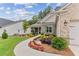 House exterior with walkway and manicured landscaping at 105 Summerlin Dr, Canton, GA 30115
