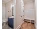 Half bathroom in the mudroom features a navy blue vanity and white tile at 3130 Waterfront Cir, Marietta, GA 30062