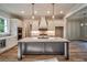 Kitchen with large island, white cabinets, pendant lighting, and hardwood floors at 3130 Waterfront Cir, Marietta, GA 30062