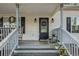 Inviting front porch with rocking chairs and wreath at 104 Streambank Ct, Temple, GA 30179