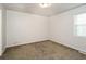 Simple bedroom with large window and carpet flooring at 4245 Brandy Ann Dr, Acworth, GA 30101