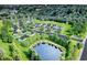 Aerial view of a new community with houses, landscaping, and a pond at 21 Cheney St, East Point, GA 30344