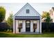 Charming white farmhouse exterior with black accents and landscaping at 21 Cheney St, East Point, GA 30344