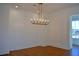 Elegant dining room featuring hardwood floors and a modern chandelier at 217 Wakehurst Way, Marietta, GA 30064