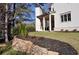 Landscaped backyard with stone retaining wall and new sod at 217 Wakehurst Way, Marietta, GA 30064