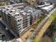 Aerial view of an apartment building and its surrounding area, including a walking path at 675 Drewry Ne St # 203, Atlanta, GA 30306