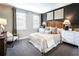 Relaxing bedroom with a king-size bed, two nightstands, and ample closet space at 3351 Orwell Way # 2104, Cumming, GA 30041