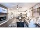Open concept living and kitchen area with modern appliances and a fireplace at 3351 Orwell Way # 2104, Cumming, GA 30041