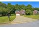 Brick house with a long driveway and well-manicured lawn at 714 Beacon Cv, Lawrenceville, GA 30043