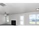 Spacious living room with fireplace and backyard access at 5908 Bluegrass Vw, Fairburn, GA 30213
