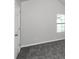 Spacious bedroom with grey carpet and window at 5908 Bluegrass Vw, Fairburn, GA 30213