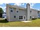 Two story house with grey siding, backyard, and patio at 5908 Bluegrass Vw, Fairburn, GA 30213