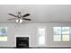 Living room with fireplace and ceiling fan at 5908 Bluegrass Vw, Fairburn, GA 30213