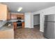 Kitchen boasts stainless steel appliances and wood cabinets at 5908 Bluegrass Vw, Fairburn, GA 30213