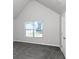 Well-lit bedroom with grey carpet and large window at 5908 Bluegrass Vw, Fairburn, GA 30213