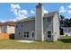 Two story house with grey siding, backyard, and patio at 5908 Bluegrass Vw, Fairburn, GA 30213