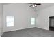 Primary bedroom with high ceilings, ceiling fan, and grey carpet at 5908 Bluegrass Vw, Fairburn, GA 30213