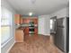 Kitchen with stainless steel appliances and wood cabinets at 5908 Bluegrass Vw, Fairburn, GA 30213