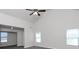 Spacious living room featuring high ceilings and a ceiling fan at 5908 Bluegrass Vw, Fairburn, GA 30213