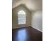 Bright bedroom with vaulted ceiling and arched window at 3897 Micah Ln, Ellenwood, GA 30294