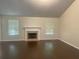 Living room with hardwood floors, vaulted ceiling, and fireplace at 3897 Micah Ln, Ellenwood, GA 30294