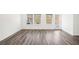 Bright living room with hardwood floors and sliding glass door to backyard at 269 Bald Ave # 18, Stockbridge, GA 30253