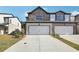 Two-story townhome with stone facade and two-car garage at 269 Bald Ave # 18, Stockbridge, GA 30253