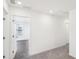Upstairs hallway with gray carpet and access to bedrooms at 269 Bald Ave # 18, Stockbridge, GA 30253