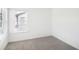 Bright bedroom with neutral carpeting and large windows at 269 Bald Ave # 18, Stockbridge, GA 30253