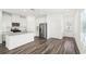 Modern kitchen with granite island, stainless steel appliances, and white cabinets at 269 Bald Ave # 18, Stockbridge, GA 30253