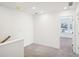 Upstairs hallway with gray carpet and access to bedrooms at 269 Bald Ave # 18, Stockbridge, GA 30253