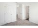 Spacious bedroom with carpeting and access to other rooms at 269 Bald Ave # 18, Stockbridge, GA 30253