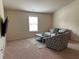 Bright bonus room with comfortable seating and large window at 4215 Almanor Cir, Norcross, GA 30071