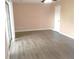 Spacious bedroom with wood-look floors and sliding glass doors at 1038 Ascot Ct, Riverdale, GA 30296