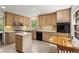Well-equipped kitchen featuring light wood cabinets and an island at 4872 Northland Dr, Atlanta, GA 30342