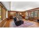 Gathering room showcasing hardwood floors, vaulted ceiling and large windows at 4872 Northland Dr, Atlanta, GA 30342