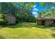 Spacious backyard with detached shed and mature trees at 4872 Northland Dr, Atlanta, GA 30342