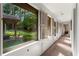 Long hallway with windows overlooking the backyard at 4872 Northland Dr, Atlanta, GA 30342