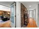 Hallway with exposed brick feature and built-in shelving at 4872 Northland Dr, Atlanta, GA 30342