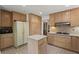 Kitchen with island, wood cabinets, and stainless steel appliances at 4872 Northland Dr, Atlanta, GA 30342