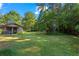 Large backyard with lush green grass and mature trees at 4872 Northland Dr, Atlanta, GA 30342