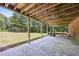Covered patio with concrete flooring and backyard access at 3651 Chandler Haulk Rd, Loganville, GA 30052