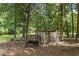 Animal pens with a feeding trough and shelter at 3651 Chandler Haulk Rd, Loganville, GA 30052
