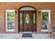 Ornate double front door with a large window at 3651 Chandler Haulk Rd, Loganville, GA 30052