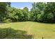 Large grassy yard with a fire pit area at 3651 Chandler Haulk Rd, Loganville, GA 30052